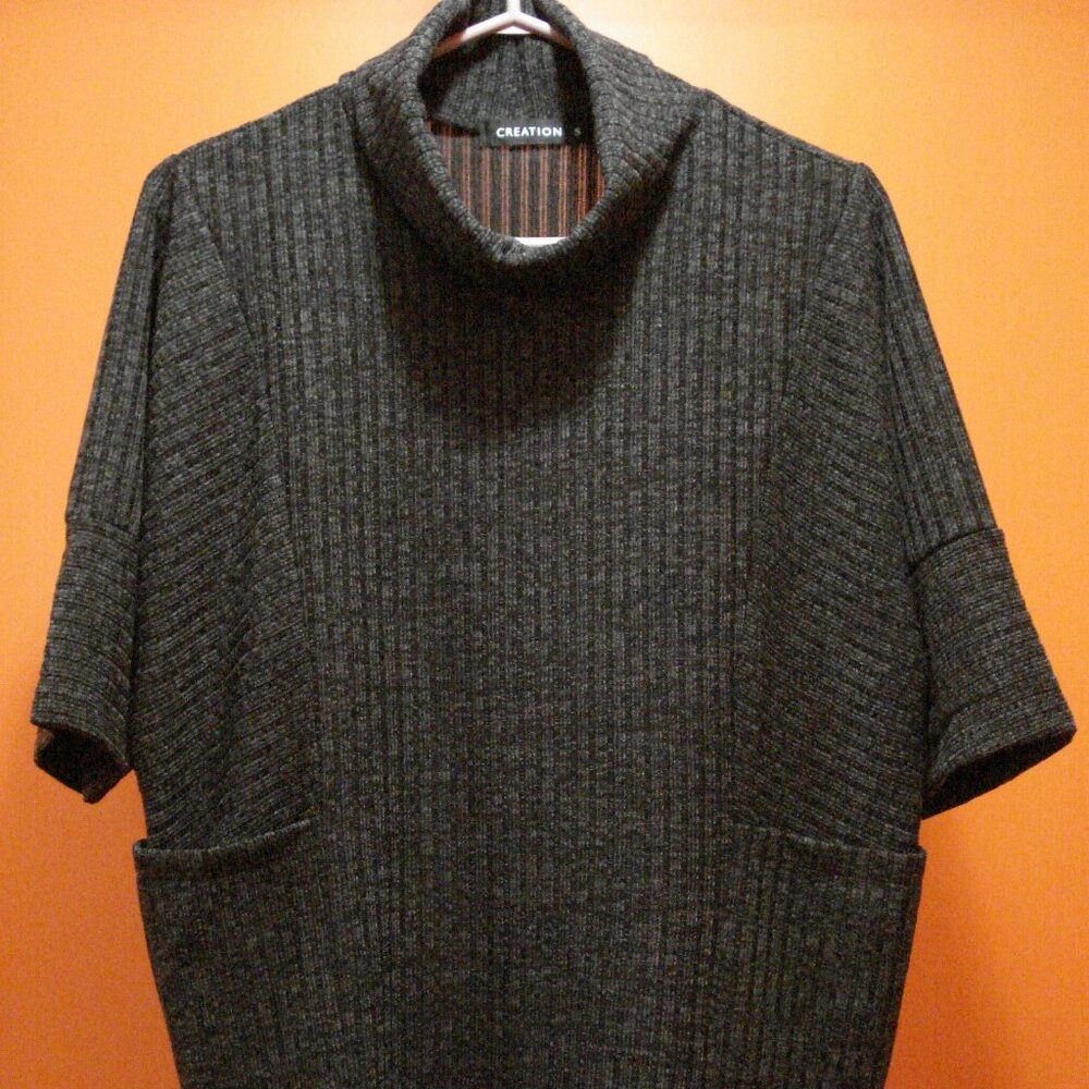 Rib-Knit Short Sleeve Turtleneck. Slip-On. Pockets. Polyester and Viscose